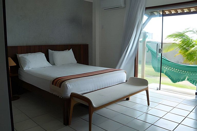 Casa Bruma |Pé na areia, encontro do rio com o mar