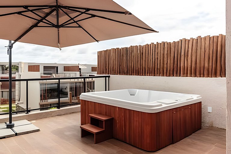 Duplex com rooftop em condomínio pé na areia