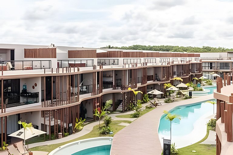 Duplex com rooftop em condomínio pé na areia